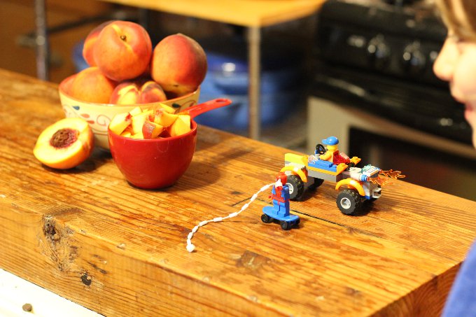 Smoothie making isn't complete without some help from Lego Spiderman and his flaming Lego four wheeler!